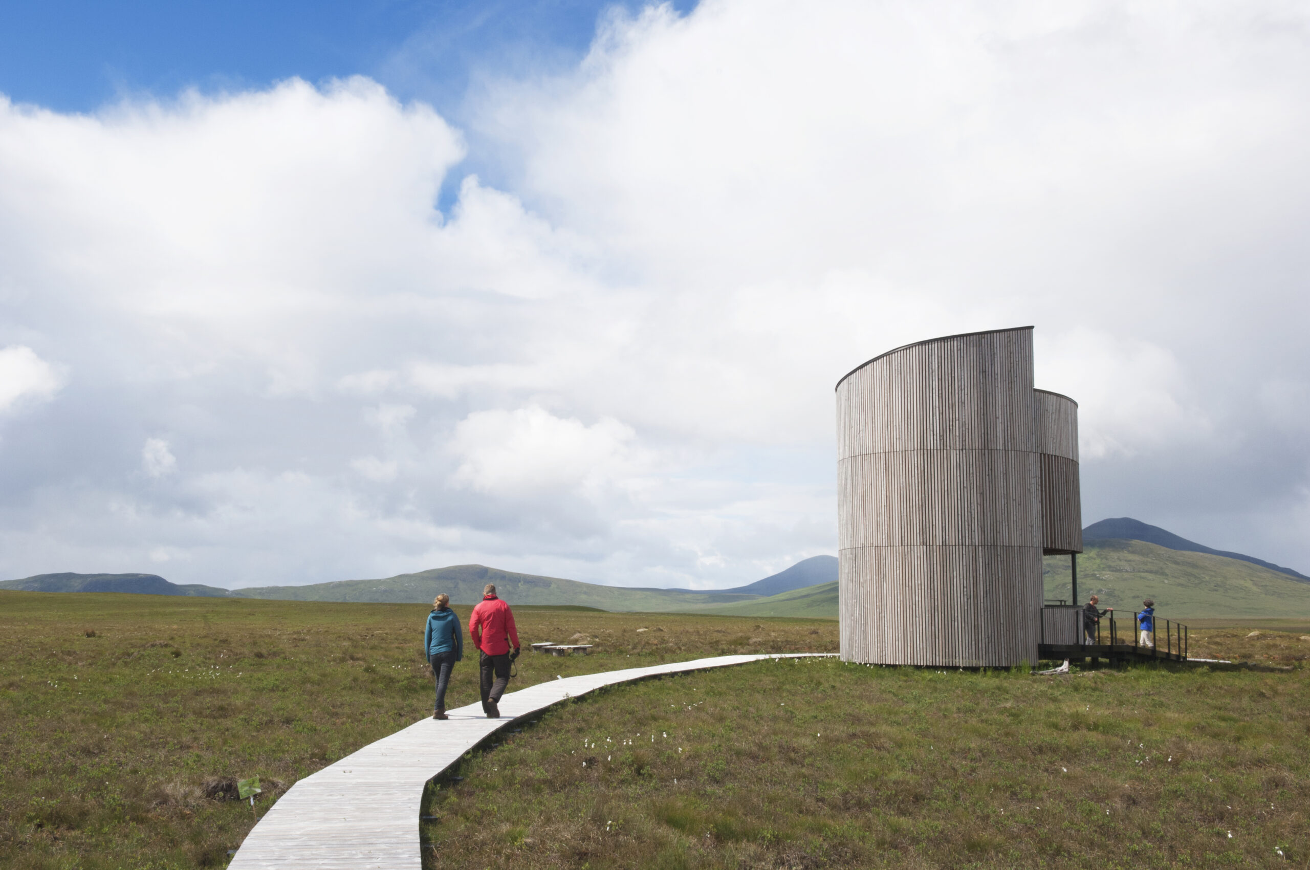 People walking along trail to Forsinard lookout tower