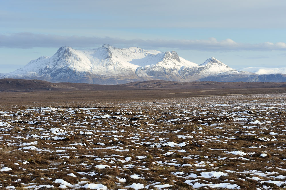 Flow country with snowy mountains in background